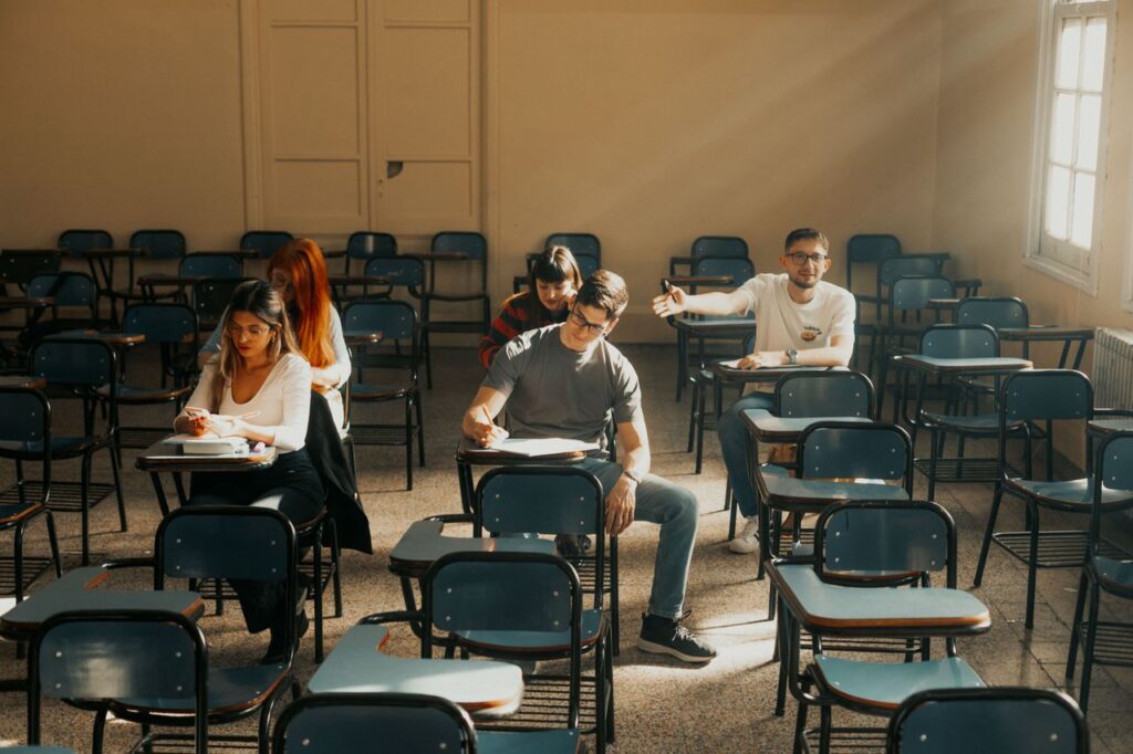 Students sit at desks taking an exam in a university classroom in Buenos Aires, Argentina.